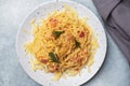 Pasta spaghetti with bacon egg cheese on a plate with spices. Traditional Italian dish Carbonara. Grey concrete table. Copy space Royalty Free Stock Photo