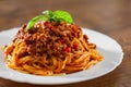 Pasta spaghetti bolognese in white plate on wooden table background Royalty Free Stock Photo