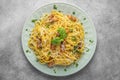 Pasta spaghetti carbonara with pancetta, bacon, egg, parmesan cheese and cream sauce on gray table Royalty Free Stock Photo