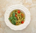 Pasta spaghetti with cherry tomatoes and basilikum in a plate Royalty Free Stock Photo