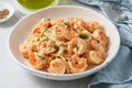 Pasta spaghetti with grilled shrimps bechamel sauce. Spaghetti with seafood rich cream, close up Royalty Free Stock Photo