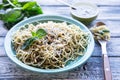 Pasta spaghetti with homemade pesto sauce and basil leafs, wood Royalty Free Stock Photo