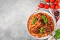 Pasta spaghetti with meatballs, tomato sauce, parmesan cheese and basil in a plate with fork. italian food. top view Royalty Free Stock Photo