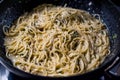 Pasta Spaghetti in Pan with Four Cheese Parmesan, Roquefort, Gravy, Gorgonzola, Cream and Garlic and Ground Pepper Royalty Free Stock Photo