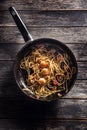 Pasta spaghetti on pan with shrimp tomato sauce toatoes and herbs. Italian or mediterranean cuisine Royalty Free Stock Photo