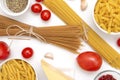 Pasta, spaghetti, a piece of cheese, garlic, tomatoes, spices, pepper on a white background