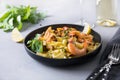 Pasta reginelle with seafood, shrimps, mussels on gray stone table, close up. Traditional dish in Italian restaurant Royalty Free Stock Photo