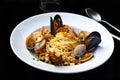 Pasta spaghetti seafood with mussels and shrimps and tomatoes, with parsley Royalty Free Stock Photo