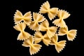 Pasta, spaghetti, shells, rings, bows on a black or white background top view