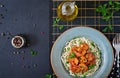 Pasta spaghetti with shrimps, tomato and chopped parsley Royalty Free Stock Photo