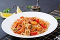 Pasta spaghetti with shrimps, tomato and parsley. Royalty Free Stock Photo