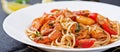 Pasta spaghetti with shrimps, tomato and parsley. Royalty Free Stock Photo