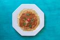 Pasta spaghetti with tomato sauce on a white plate. Top view with copy space. Blue background Royalty Free Stock Photo