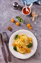 Pasta spaghetti with tomatoes and fresh basil in a plate Royalty Free Stock Photo