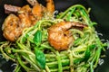 Pasta spaghetti zucchini basil pesto sauce and grilled shrimp, Vegetarian vegetable pasta, Food recipe background. Close up