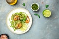 Pasta spaghetti zucchini basil pesto sauce and grilled shrimp, Vegetarian vegetable pasta, Restaurant menu, dieting, cookbook Royalty Free Stock Photo