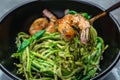 Pasta spaghetti zucchini basil pesto sauce and grilled shrimp, Vegetarian vegetable pasta, Restaurant menu, dieting, cookbook Royalty Free Stock Photo