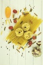 Pasta and spices are sprinkled on the table on the table Royalty Free Stock Photo