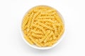 Pasta spiral or fusilli close-up in white bowl, white background Royalty Free Stock Photo