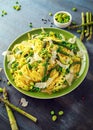 Pasta tagliatelle with asparagus, peas, beans and parmesan cheese on top. healthy food Royalty Free Stock Photo