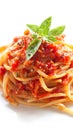 Pasta with tomato sauce and basil garnish, simple background, space reserved for recipe Royalty Free Stock Photo
