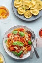 Pasta with tomato sauce and basil, ravioli, and wine glasses, Italian dinner Royalty Free Stock Photo