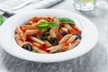 Pasta with tomato sauce olives and capers Royalty Free Stock Photo