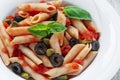 Pasta with tomato sauce olives and capers Royalty Free Stock Photo