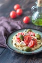 Pasta with tomato sauce, olives and capers on the plate Royalty Free Stock Photo