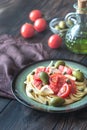 Pasta with tomato sauce, olives and capers on the plate Royalty Free Stock Photo