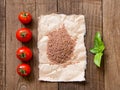 Pasta, tomatoes and basil on wooden background Royalty Free Stock Photo