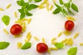 Pasta,tomatoes and fresh basil leaves Royalty Free Stock Photo