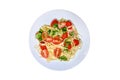Pasta with tomatoes, isolated on a white background. Plate with spagh Royalty Free Stock Photo