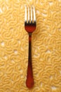 Pasta tubes background with fork Royalty Free Stock Photo