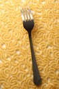 Pasta tubes background with fork Royalty Free Stock Photo