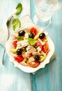 Pasta with tuna, cherry tomatoes, black olives, spices and fresh basil.