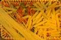 Pasta variation in a brown basket . Royalty Free Stock Photo