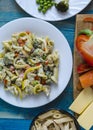 Pasta with vegetables and cheese on a white plate color background cooking homemade food vertical Royalty Free Stock Photo