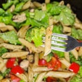 Pasta with vegetables cooked in a frying pan. close up. Royalty Free Stock Photo