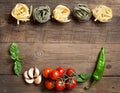 Pasta, vegetables and herbs on wood Royalty Free Stock Photo