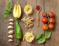 Pasta, vegetables and herbs on wood Royalty Free Stock Photo