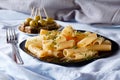 Pasta with watercress and canape with olives