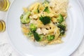 Pasta in a white sauce with broccoli and cheese. Penne, Italian dish with chicken, mediterranean cuisine, top view. Royalty Free Stock Photo