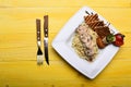 Pasta with white sauce and decor on yellow wooden background Royalty Free Stock Photo