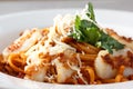 Pasta (spaghetti) with scallops and tomato sauce