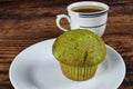 pastachio muffin with a cup of green tea Royalty Free Stock Photo