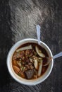 Paste of rice flour in a paper cup on a wooden table Royalty Free Stock Photo