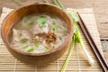 Paste of rice flour with pork in wooden bowl Royalty Free Stock Photo