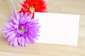 Pastel artificial flower with white note paper