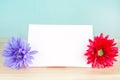Pastel artificial flower with white note paper